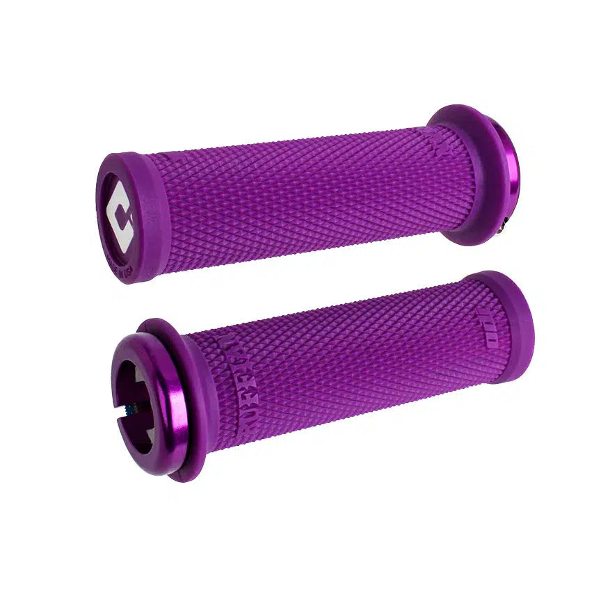 Two ODI BMX Mini Ruffian 110mm V2.1 grips in purple, featuring a textured surface and end caps, constructed from Soft Compound TPE material and displayed on a white background.