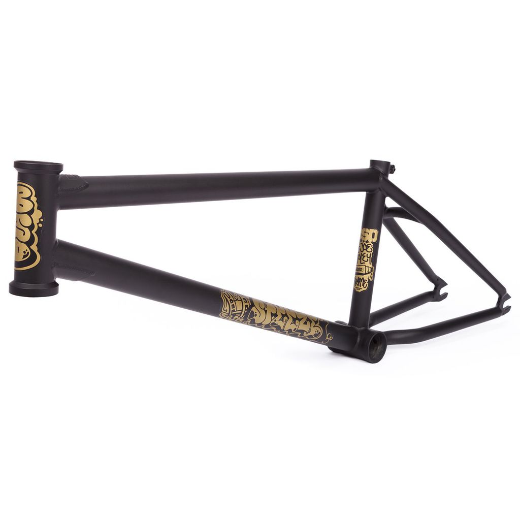 The BSD Steeze Frame (Joe Foley) is a black 2024 BMX bicycle frame featuring gold graphics on both the head tube and down tube, emphasizing its SuperScoop chainstays. Displayed from the side, this design embodies a dynamic look that mirrors Joe Foley's distinctive style.