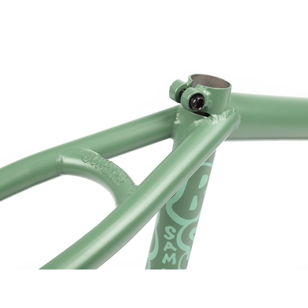 Close-up of a green BSD Jonesin Frame (2021) with a top clamp, displaying its sleek modern street geometry. A white logo and text are visible on this Sam Jones signature frame.