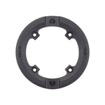 Circular black sprocket protector designed for bicycles, featuring four bolt holes and a nylon-fibreglass guard to ensure friction-free grinding. The text "Eclat" and "N.T.F.G 28" is displayed on the guard, which is compatible with AK and ELEVATE sprockets. This product is known as the Wethepeople Viper Sprocket Replacement Guard.