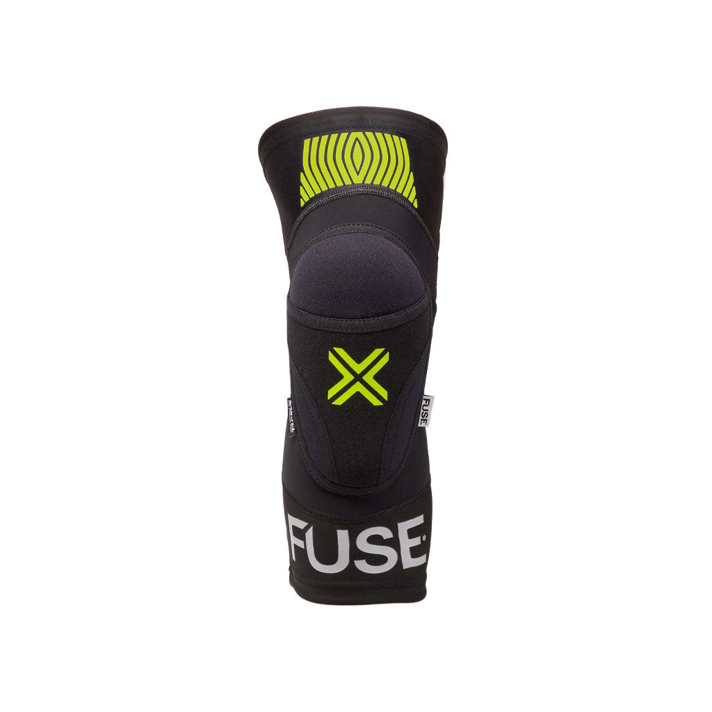 A black Fuse Omega Knee Pad with the word "FUSE" at the bottom and a green X design in the center, made from compression Lycra and featuring a SAS-TEC insert, designed for protective sports use.