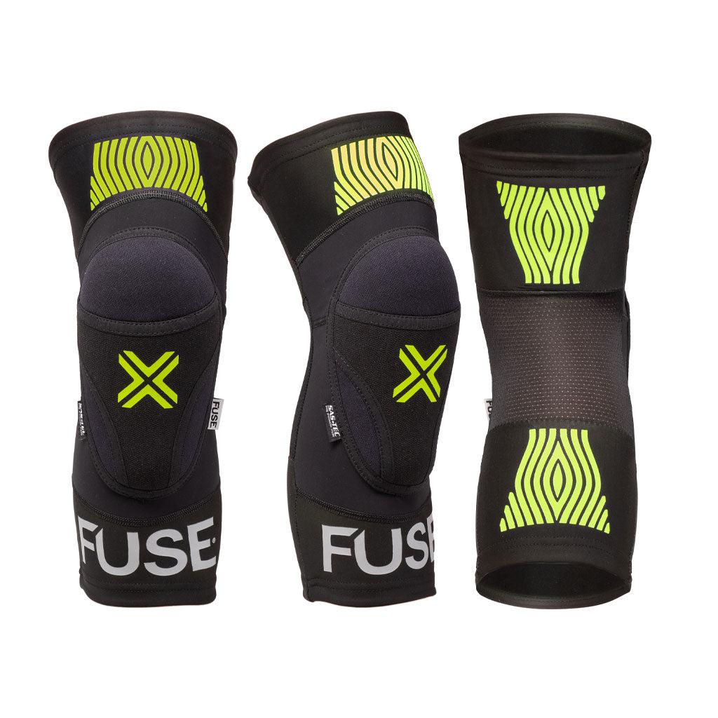 Three black and neon green Fuse Omega Knee Pads with the brand "FUSE" displayed on the bottom. Featuring compression Lycra for enhanced comfort, each pad is shown from the front, side, and back views.