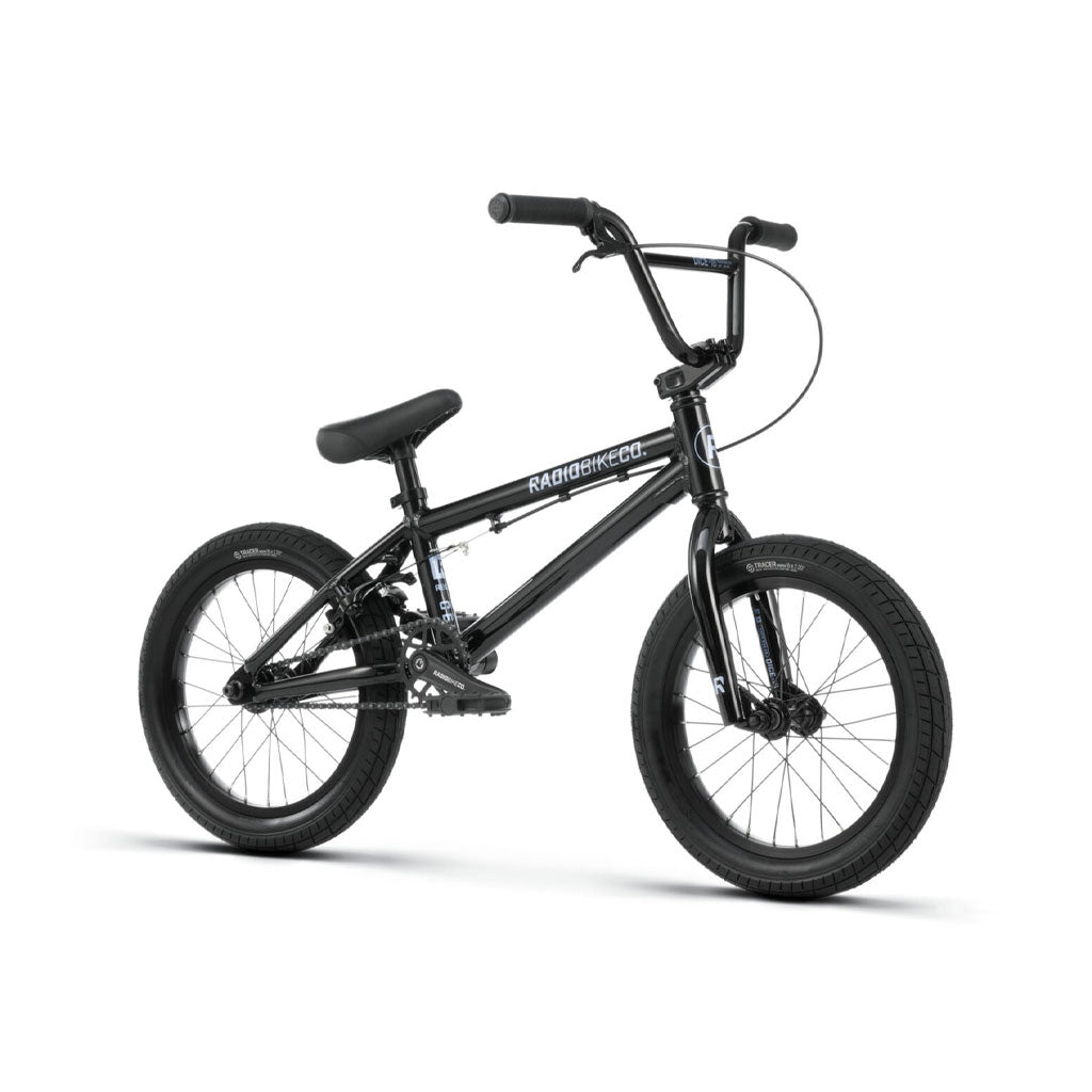A black Radio Dice 16 Inch Bike with a compact 6061 Alloy frame, 16-inch thick Salt Traction Tyres, and a sloped top tube. The bike features a padded seat, hand grips, and reflectors on the pedals.