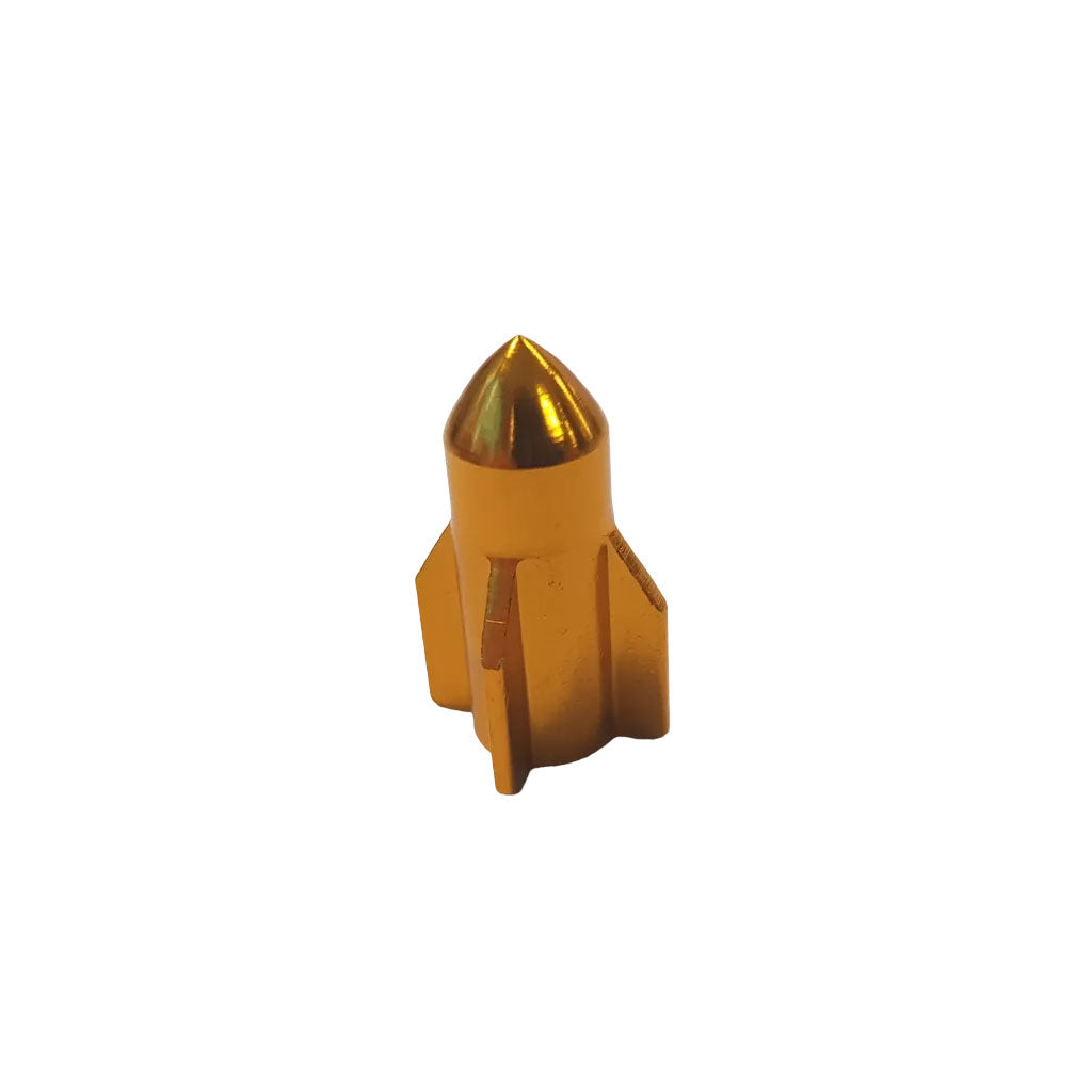 A pair of Guided Missile Valve Caps, gold-colored with a sleek metal finish and a smooth surface, shaped like rockets with pointed tips, perfect for bike accessories, set against a white background.