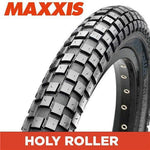 The Maxxis Holy Roller Tyre, with its unique knobby tread design, shines against a white background as a versatile performer.