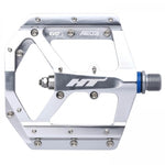 Silver CNC aluminum pedals by HT, the AE03 model, featuring replaceable SAP grip pins.