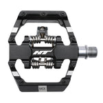 The HT D1 Pedals (Alloy / CNC CRMO) come in a sleek black and silver finish and boast a metal axle, spring mechanism, and durable aluminum body. These dual-function pedals feature replaceable grip pins to enhance traction and performance.