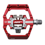 The HT D1 Pedals, featuring an alloy construction and CNC CRMO design, are hexagonally shaped with a visible brand logo. They include an aluminum clip-in mechanism and the exclusive HT system for enhanced performance.