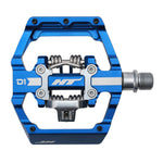 The HT D1 Dual Function Clip/Flat Pedals feature a blue and silver aluminum body with a spring mechanism and sealed bearings for smooth performance.