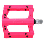 The HT PA12A Pedals feature bright pink nylon construction with black pins, a silver CNC Cromoly spindle, and the HT logo on the side.