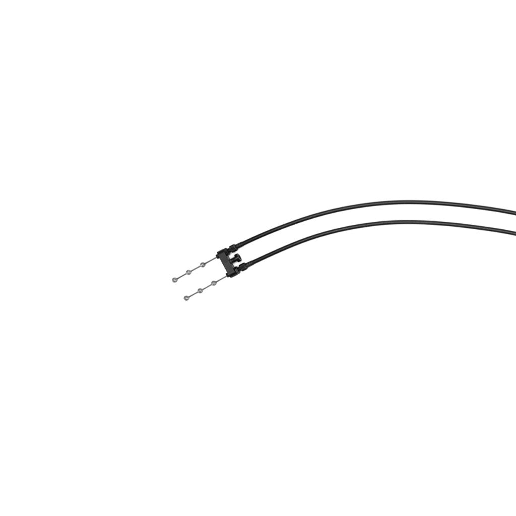 The KINK Lower Gyro Cable, featuring two black cables with metal connectors on a white background, connected at a central joint, exemplifies a dual cable system.