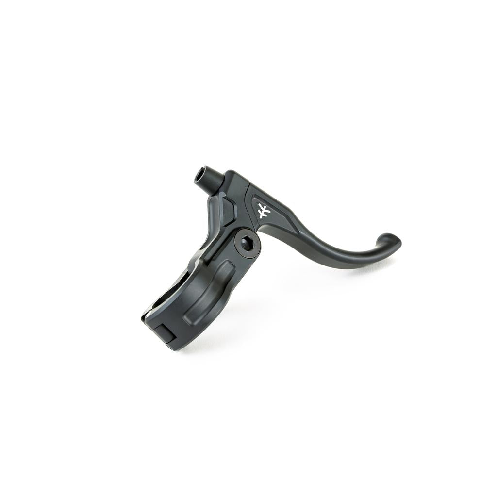 The Fly Bikes Manual CNC Brake Lever is a black metal brake lever made of sturdy 6061-T6 aluminum, featuring a curved handle and mounting clamp. It's enhanced with a CNC finish and includes an Igus polymer bushing for smooth operation.