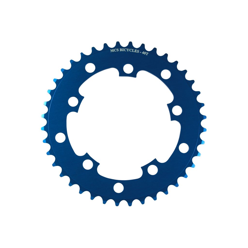 A blue MCS 110BCD 5 Bolt Chainring, CNC machined from 6061 aluminium, with the text "MCS BICYCLES - 40T" etched on the top. Featuring multiple holes and evenly spaced teeth around its edge, it's perfect for BMX racing.