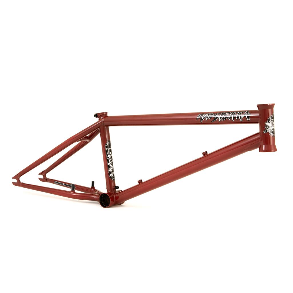 The Fly Bikes Motosierra Frame is red with white graphics on the top tube and head tube. It features welded chainstay brake mounts, trails-specific geometry, and is set against a plain white background.