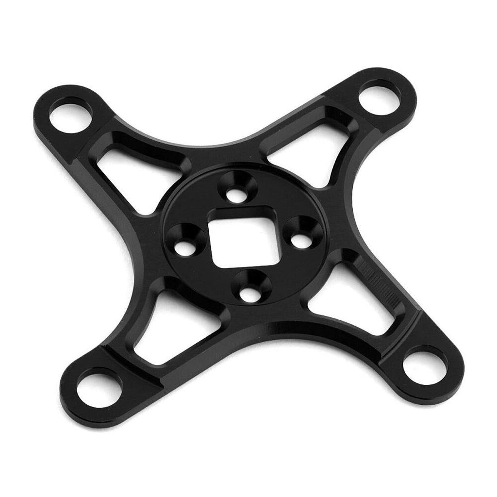 The Calculated VSR R Series Crank 4 Bolt Spider 104bcd is a CNC machined black star-shaped component from durable 6061 aluminium with four circular holes at each arm for mounting or fitting.