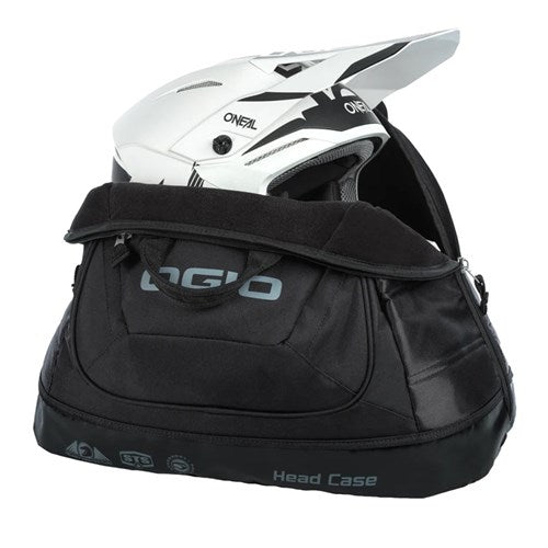 A white motocross helmet fits securely in a black Ogio Head Case Helmet Bag, providing excellent protection during transport.