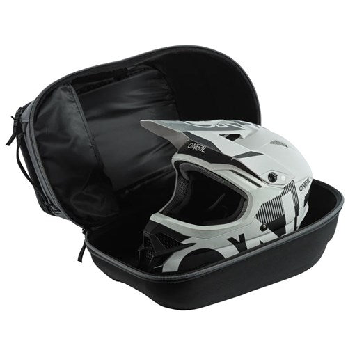 The Oneal ATS Case Bag, in black, holds a white and black full-face helmet, showcasing its protective shell and adjustable interior padding when partially open.