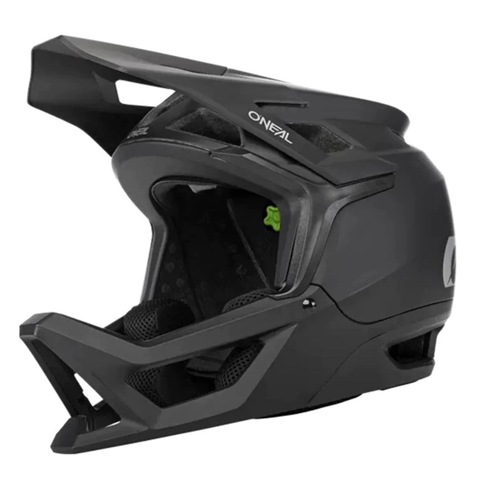 The Oneal Transition Helmet is a black, lightweight full-face helmet featuring a visor, chin guard, and ventilation openings for maximum airflow.