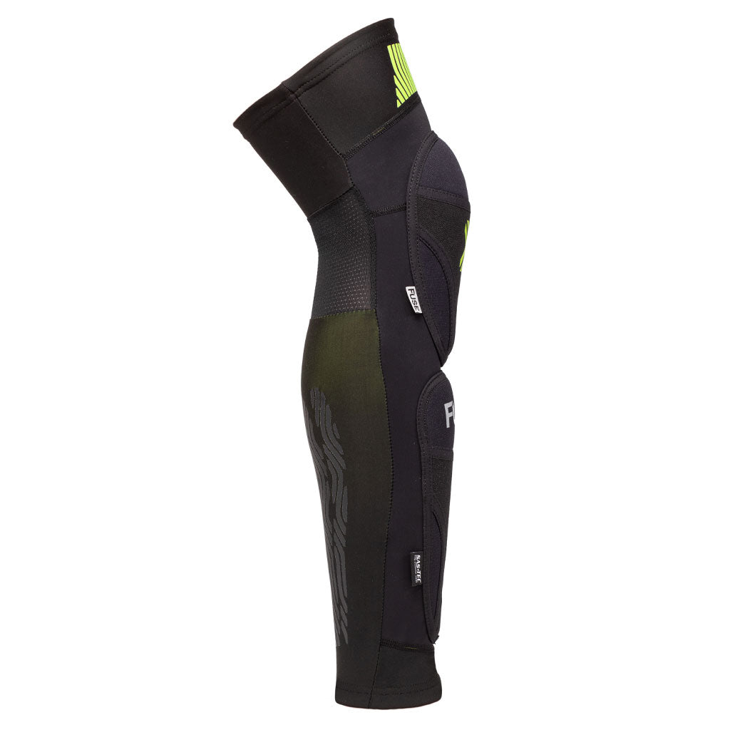 Side view of the Fuse Omega 100 Knee Shin Ankle Combo Pads in black with yellow accents, featuring a Kevlar section and protective padding, designed for sports or biking.