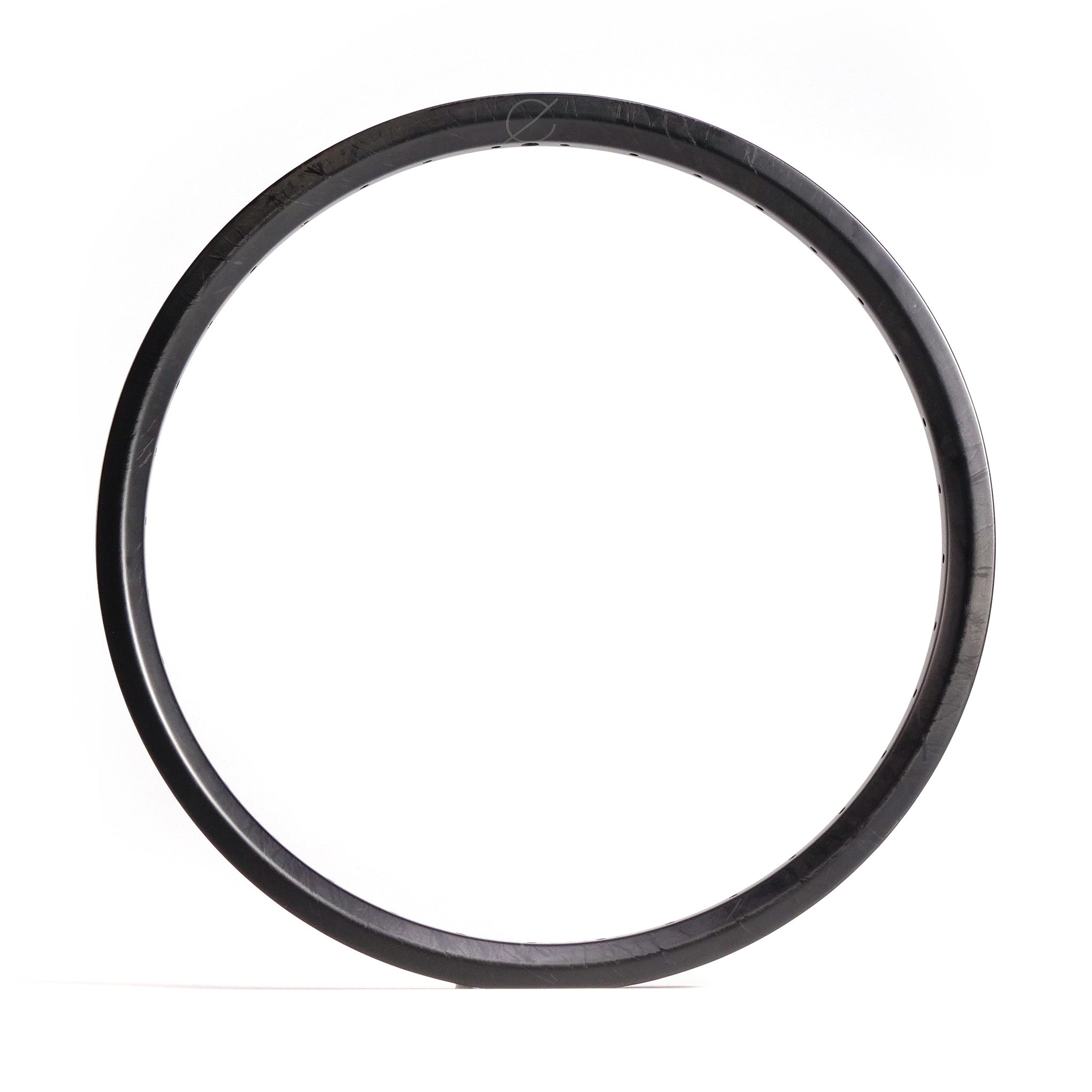 A black circular hoop with a thin profile against a white background, reminiscent of the sleek design found in BMX race and freestyle Spectre NME Carbon Fibre 20 Inch Brakeless Rim.