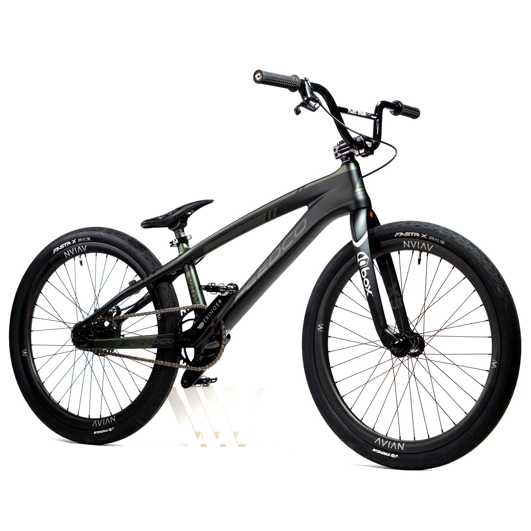 A sleek black Speedco Velox Pro XL Cruiser Custom Bike, featuring thick tires, front suspension, and a minimalist frame, is showcased against a plain white background.