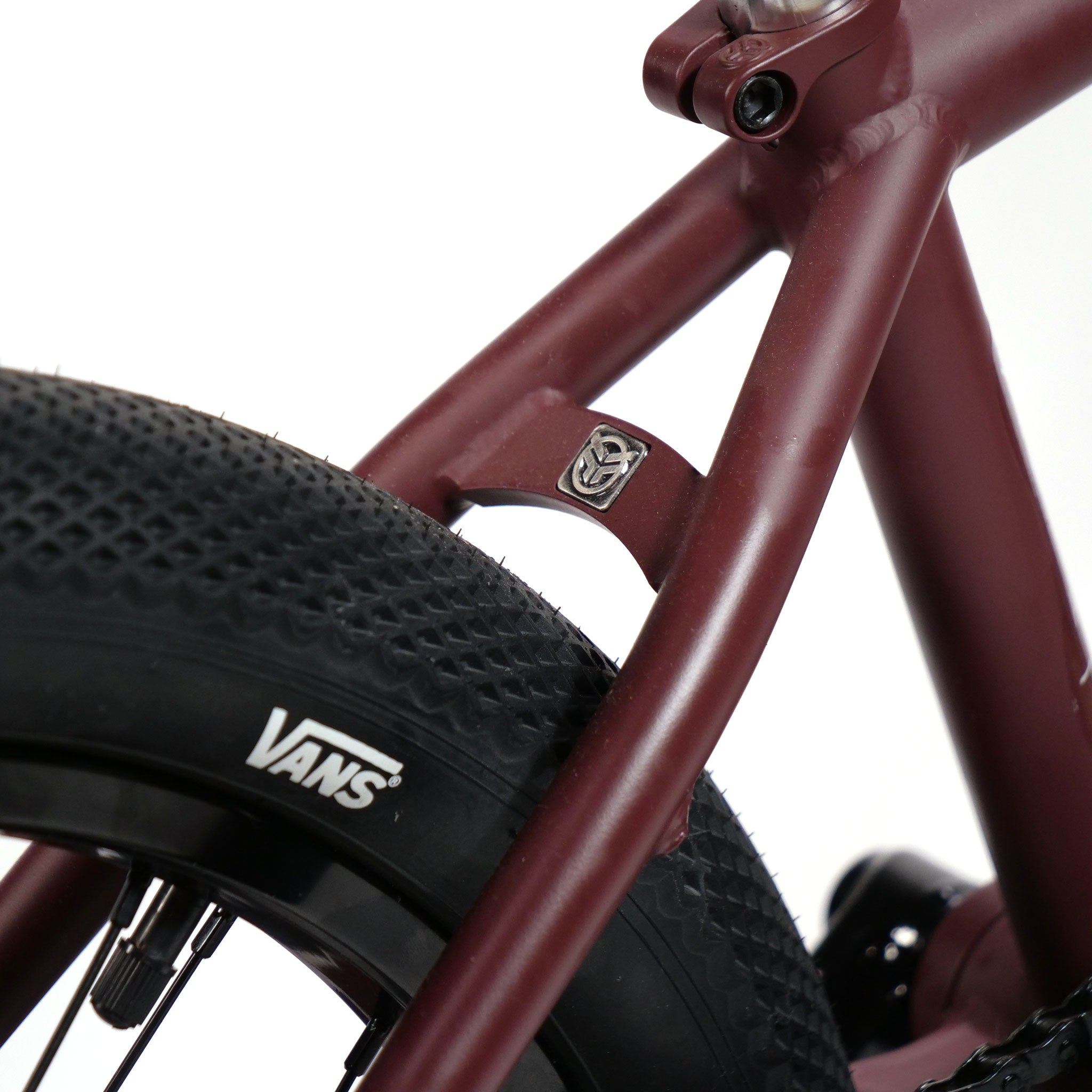 Close-up of a maroon "Federal YUNGBOYD" 18-inch custom bike frame with wide textured tires, featuring freestyle custom aftermarket parts against a white background.