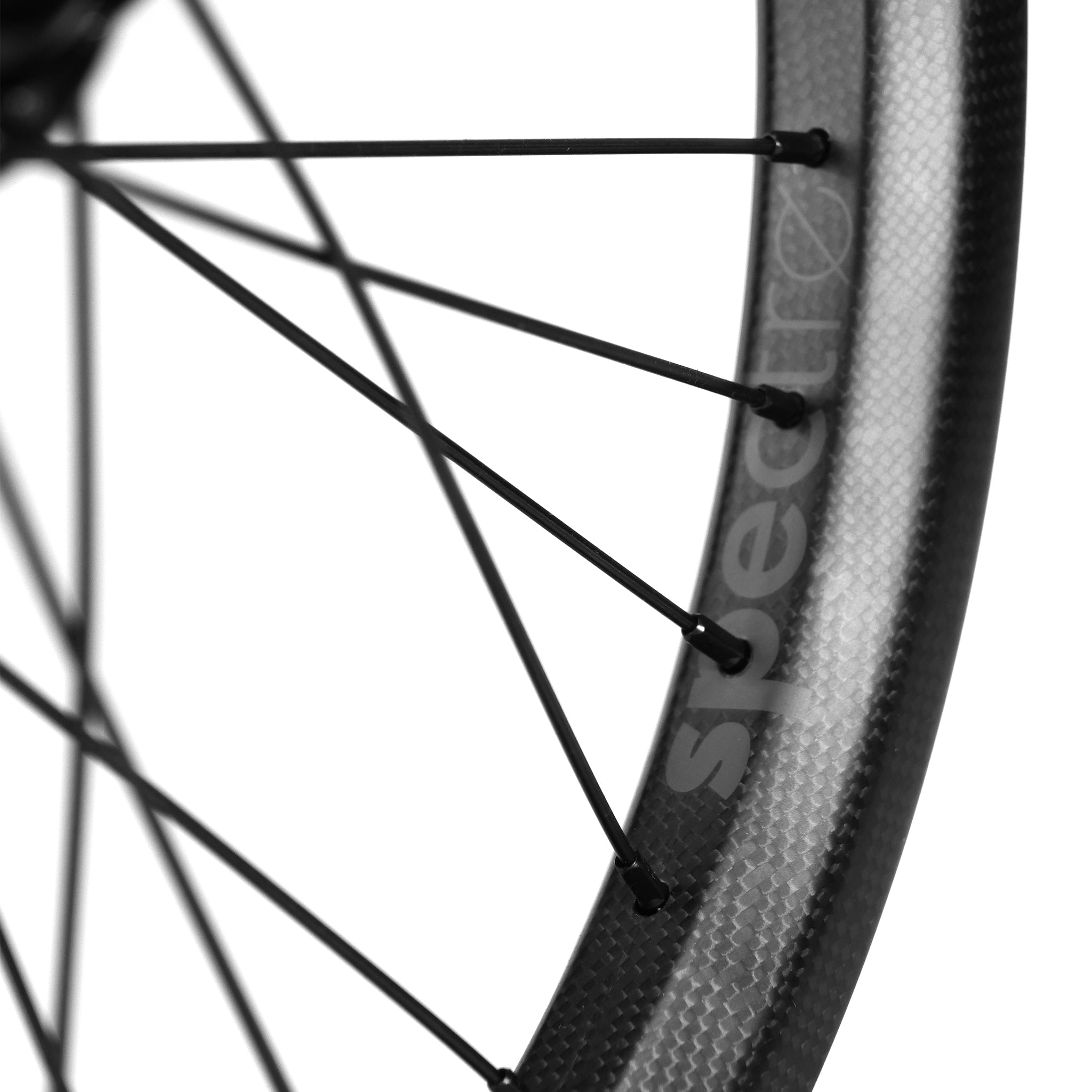 Close-up of an Onyx X Spectre Carbon Battlesnake 20-inch wheelset showcasing sleek black spokes and a robust carbon fiber rim, akin to BMX wheels. The "Spectre" branding stands out, emphasizing its precision engineering and design.