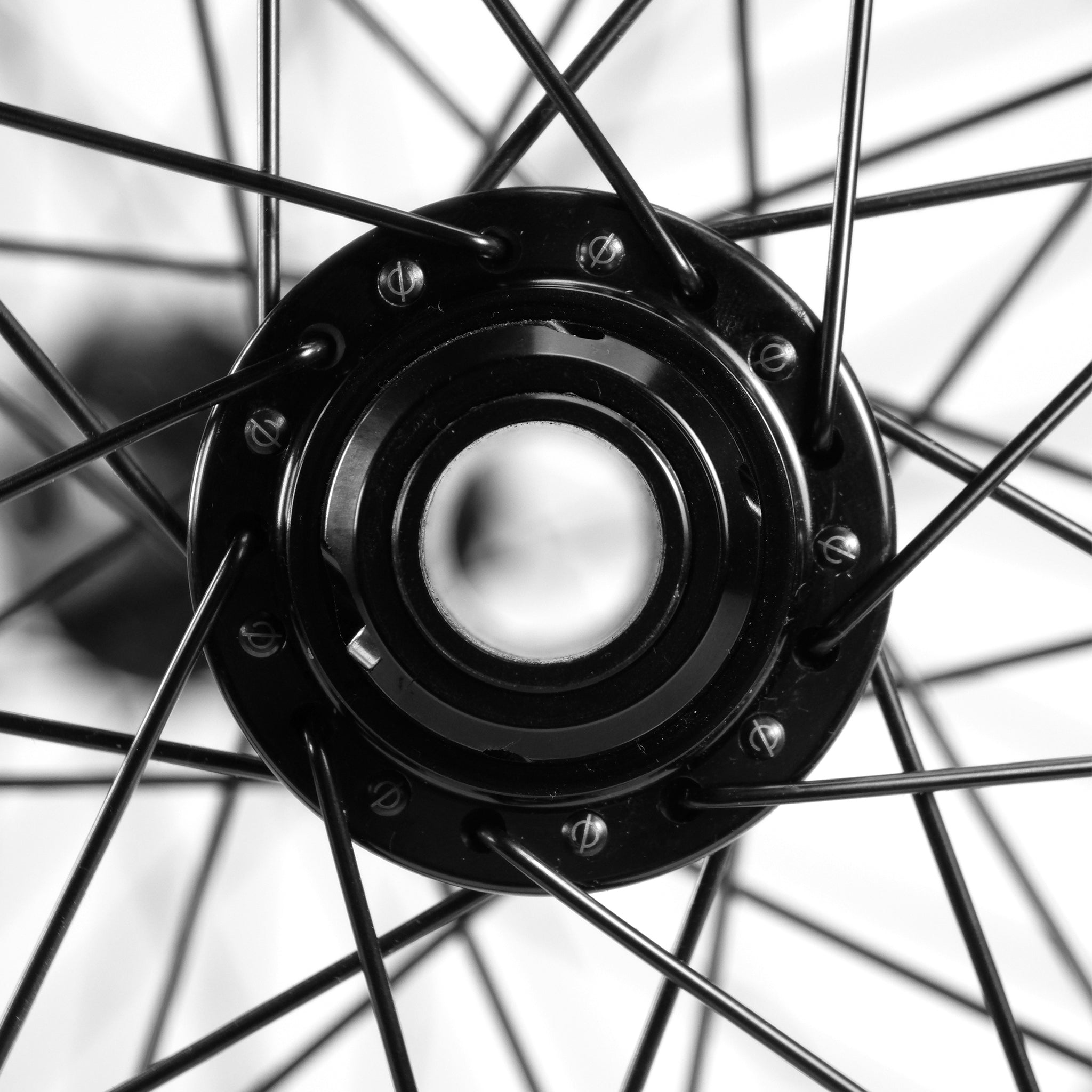 Close-up of the black Onyx X Spectre Carbon Battlesnake 20-inch wheelset, showcasing BMX wheels with numerous spokes on a white background.