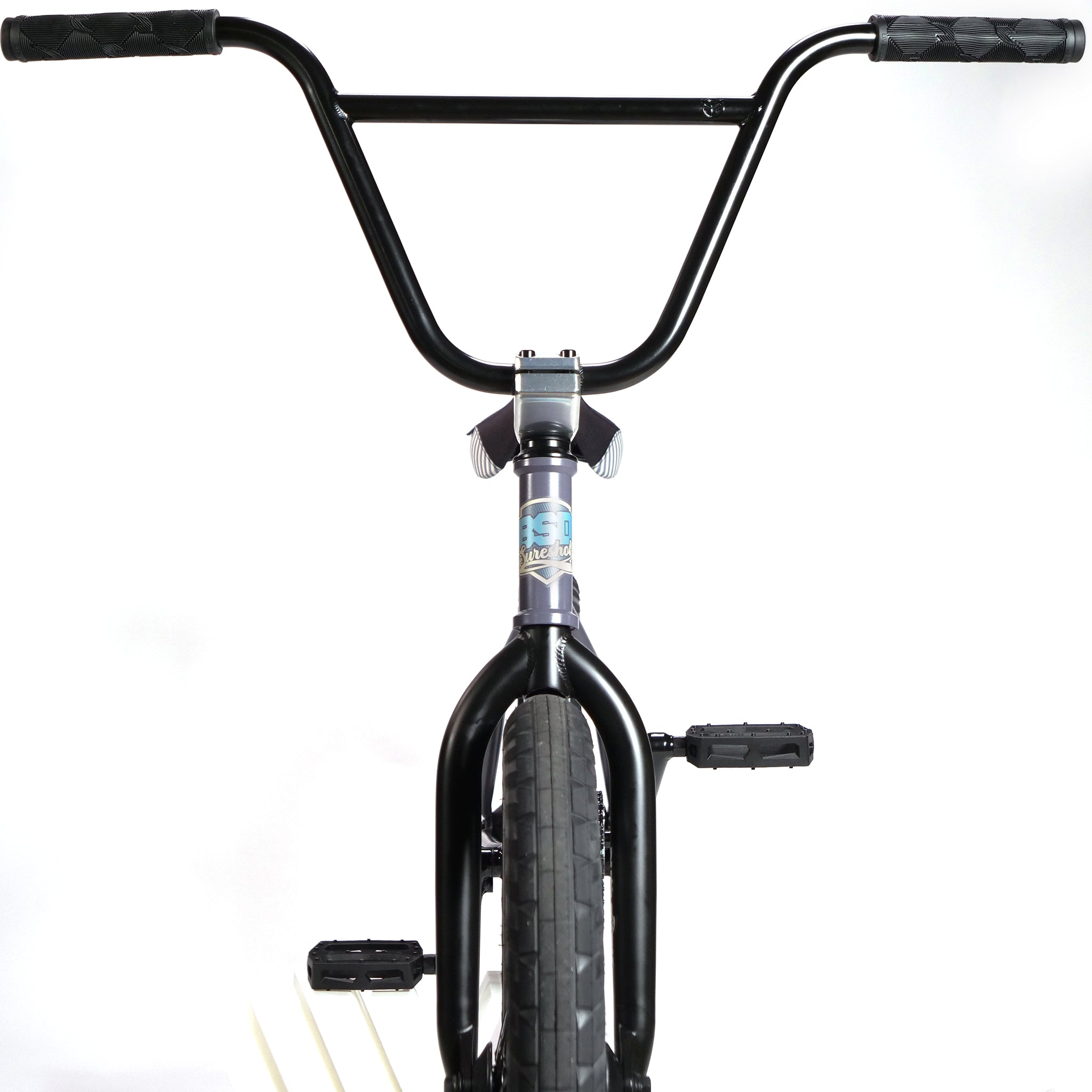 Front view of the BSD Long Shot Custom BMX Bike showcasing its handlebars, front wheel, and pedals against a white background.