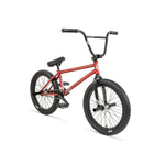 Introducing the Fly Bikes Proton CST 20 Inch Bike, a sleek red BMX equipped with black handlebars, tires, and pedals. It features a durable CrMo frame and robust tires designed for tricks and stunts. Enjoy its smooth performance thanks to reliable sealed hubs.