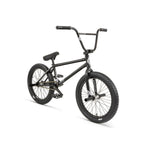 The Fly Bikes Proton CST 20 Inch Bike showcases a sleek design when viewed at an angle, featuring a black CrMo frame, high-rise handlebar, large tires, and sealed hubs.