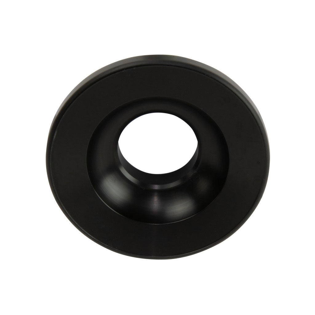 A black, round object with a central circular hole, resembling a large washer or bushing, CNC machined from Delrin, shown against a white background. This is the Profile C4 Rear Hub Guard (non drive side).