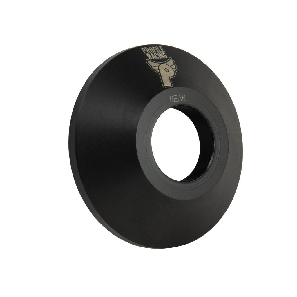 A black, circular Profile C4 Rear Hub Guard (non drive side) for BMX bikes with a central hole and "Profile Racing" branding on the surface, CNC machined from Delrin for durability.