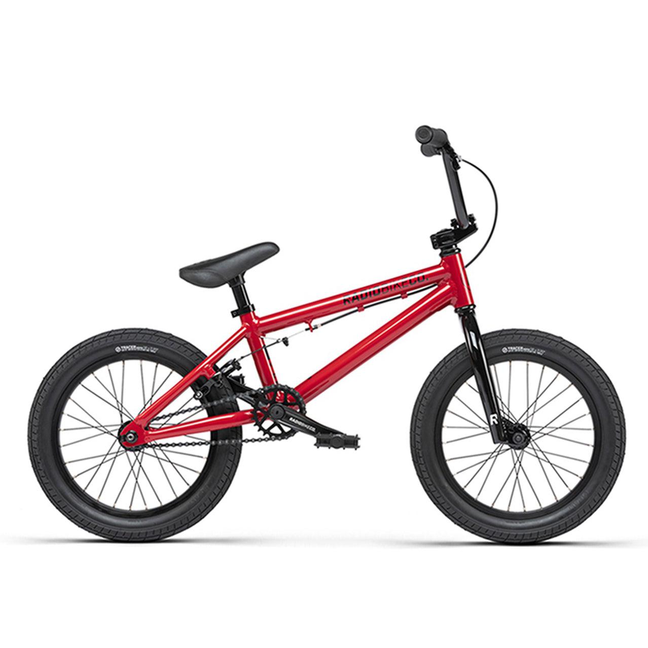 A red Radio Dice 16 Inch Bike with black Salt Traction Tyres and 6061 Alloy frame, featuring black handlebars, viewed from the side against a white background.