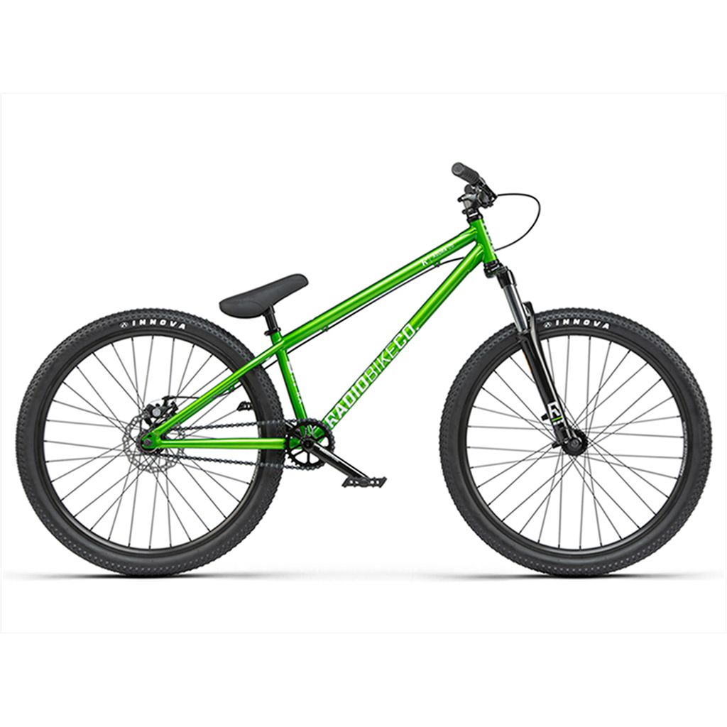 The Radio 26 Inch Asura Bike is a green, single-speed mountain bike with large black tires and a front suspension fork, featuring a durable chromoly/steel frame, displayed on a white background.