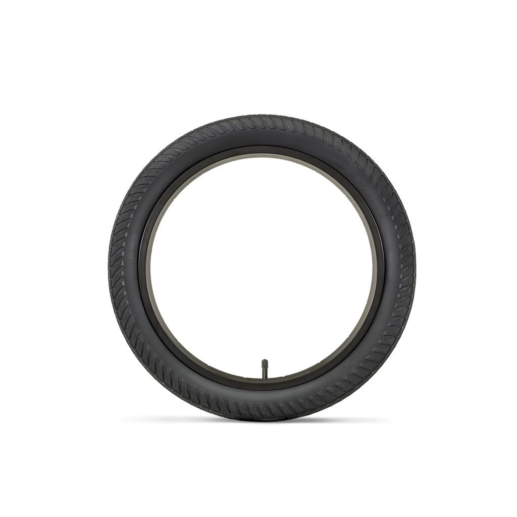 A Fly Bikes Ruben Foldable Tyre is shown upright on a white background, featuring its puncture-resistant layer and visible valve stem at the bottom, designed to handle up to 110 PSI.