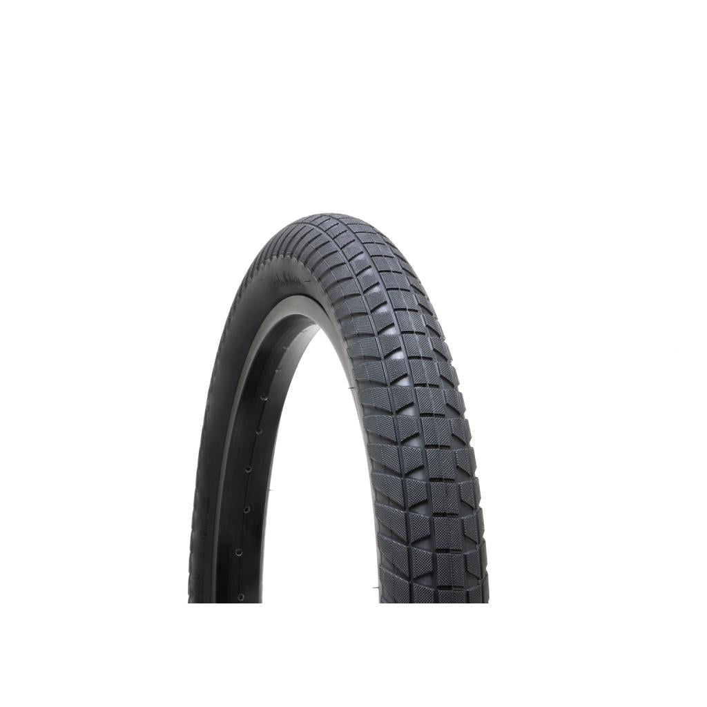 The Fly Bikes Ruben 16 Inch Tyre, with a textured tread for better grip, is shown against a white background. This BMX tire includes a pinch-resistant layer, ensuring durability and performance during demanding rides.