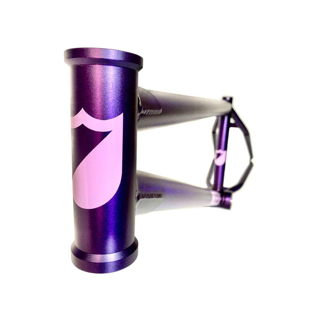 Close-up of an ATF XL (Aryei Levenson) Frame bicycle in the Purple Haze colorway with a white shield-shaped logo on the head tube, viewed from an angle.