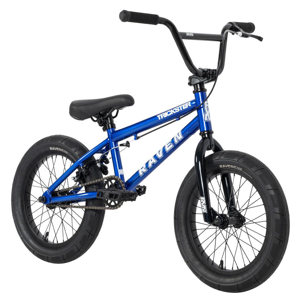 A Raven Trickster 16 Inch BMX bike in blue and black, featuring the "Trickster" logo on the frame, thick tires, handlebars with grips, a padded seat, and sealed hubs.