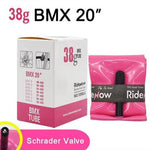 The packaging for the RideNow 20 Inch Tube featuring a Schrader (Car) Valve is displayed next to the deflated pink ultra lightweight tube, with size specifications on the right.