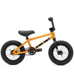 An orange Kink Roaster 12 inch Bike (2025) with black handlebars, seat, pedals, and tires. Featuring 12” wheels and a solid frame, this child's first BMX bike is designed without training wheels and includes a coaster brake for safe stopping.