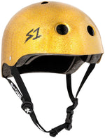 The yellow glittery S-One Helmet Lifer Gold Glitter features black straps, ventilation holes, and an "S1" logo. This multi-impact helmet includes an adjustable chin strap for added security.