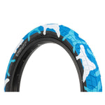 A blue and white Salt Tracer 18in Tyre (Each) with a camouflage pattern featuring directional tread design.