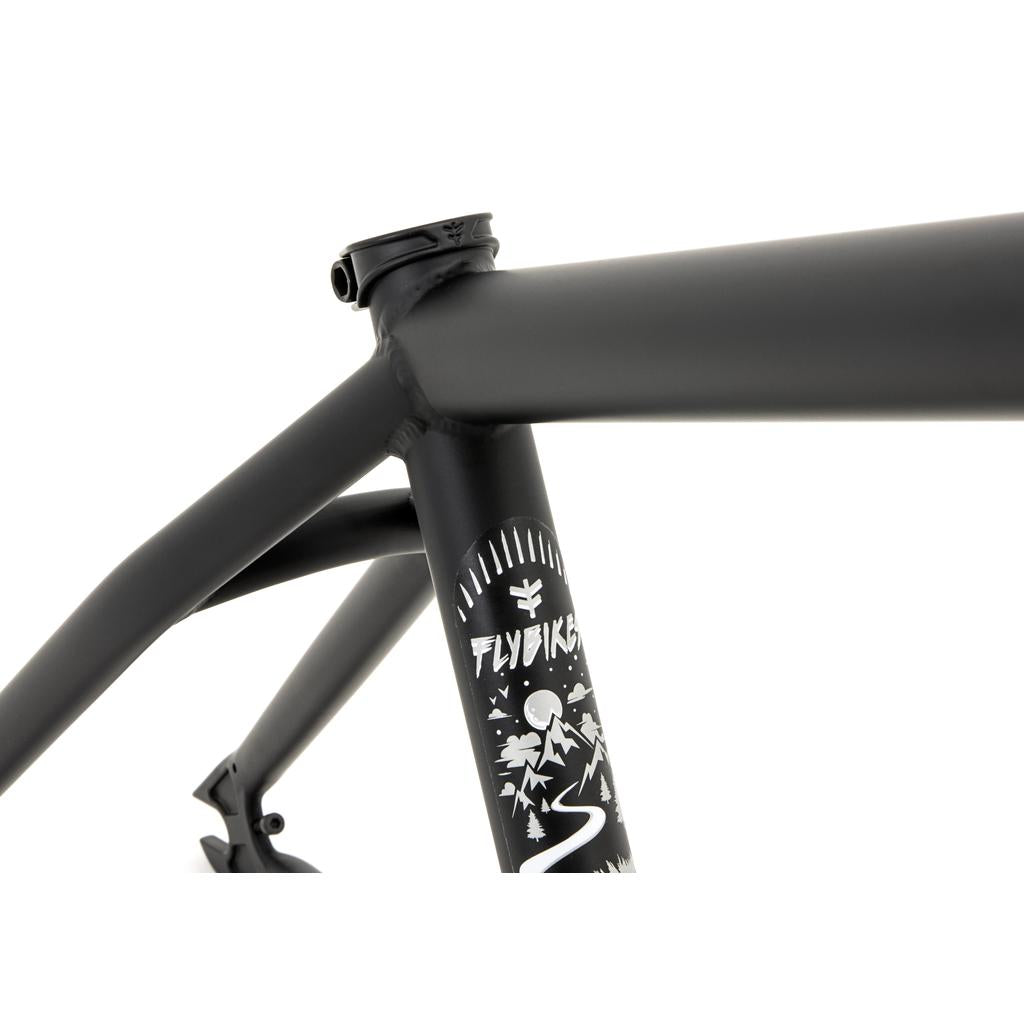 Close-up of a black Fly Bikes Sierra Frame highlighting branding and graphics. Crafted with 4130 CrMo for strength, the tubing connections feature a matte finish.