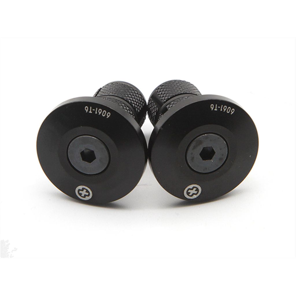 A pair of Salt Plus HQ Handlebar Plugs, crafted as CNC machined alloy bar ends with hexagonal central holes and smaller circular holes at the bottom, labeled "6001-16".