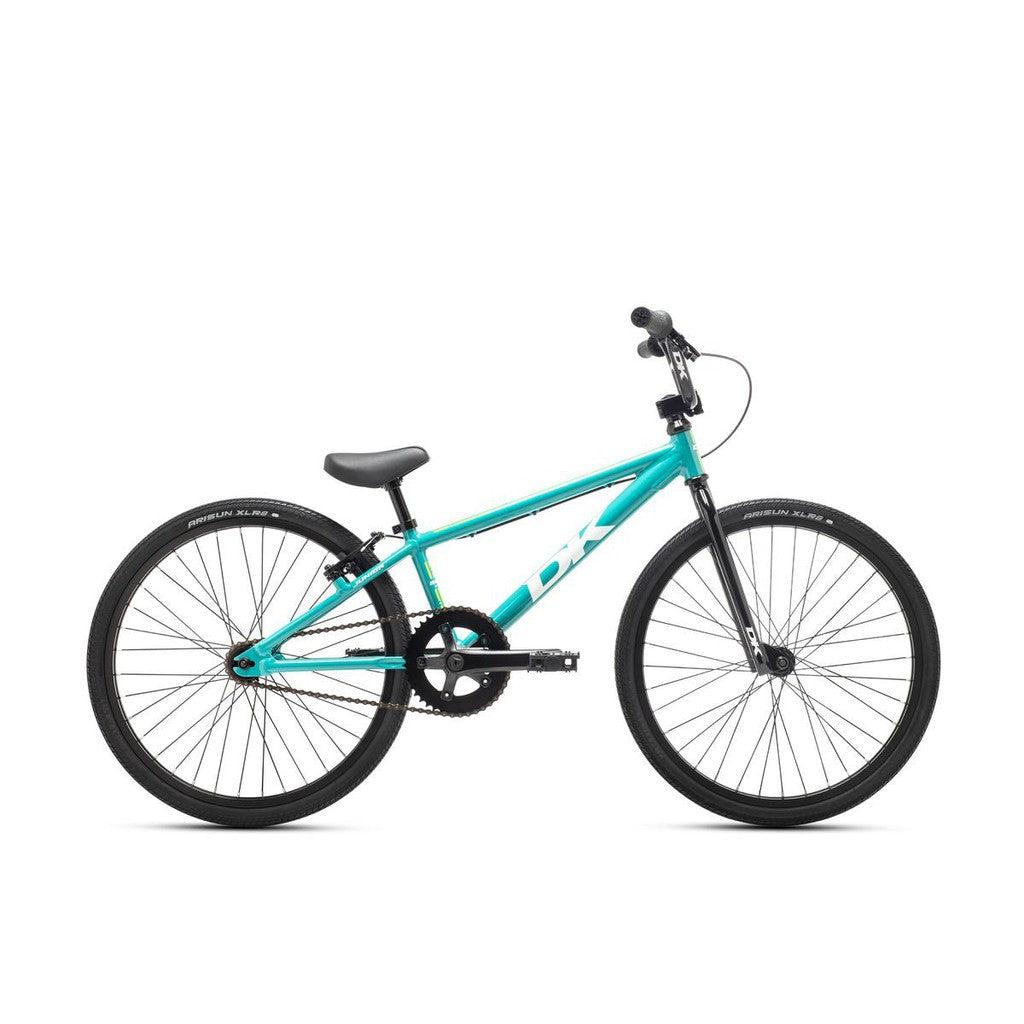 The DK Swift Junior Bike has a lightweight aluminum frame, finished in turquoise with black seat, handlebars, and tires.