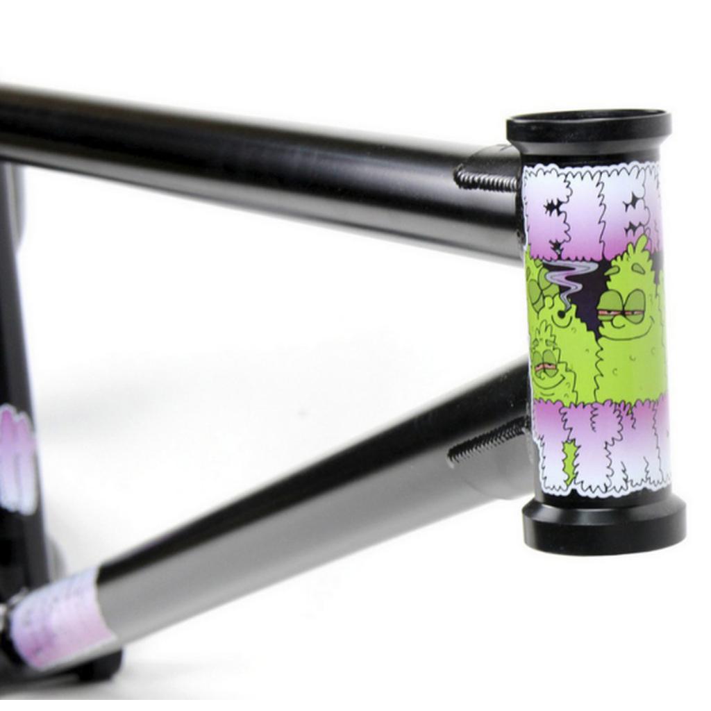 The Fiend Morrow V4 Frame in black features a colorful cartoon decal with green, fuzzy characters and purple text. Its 4130 chromoly construction and street-oriented geometry promise durability and style for every ride.