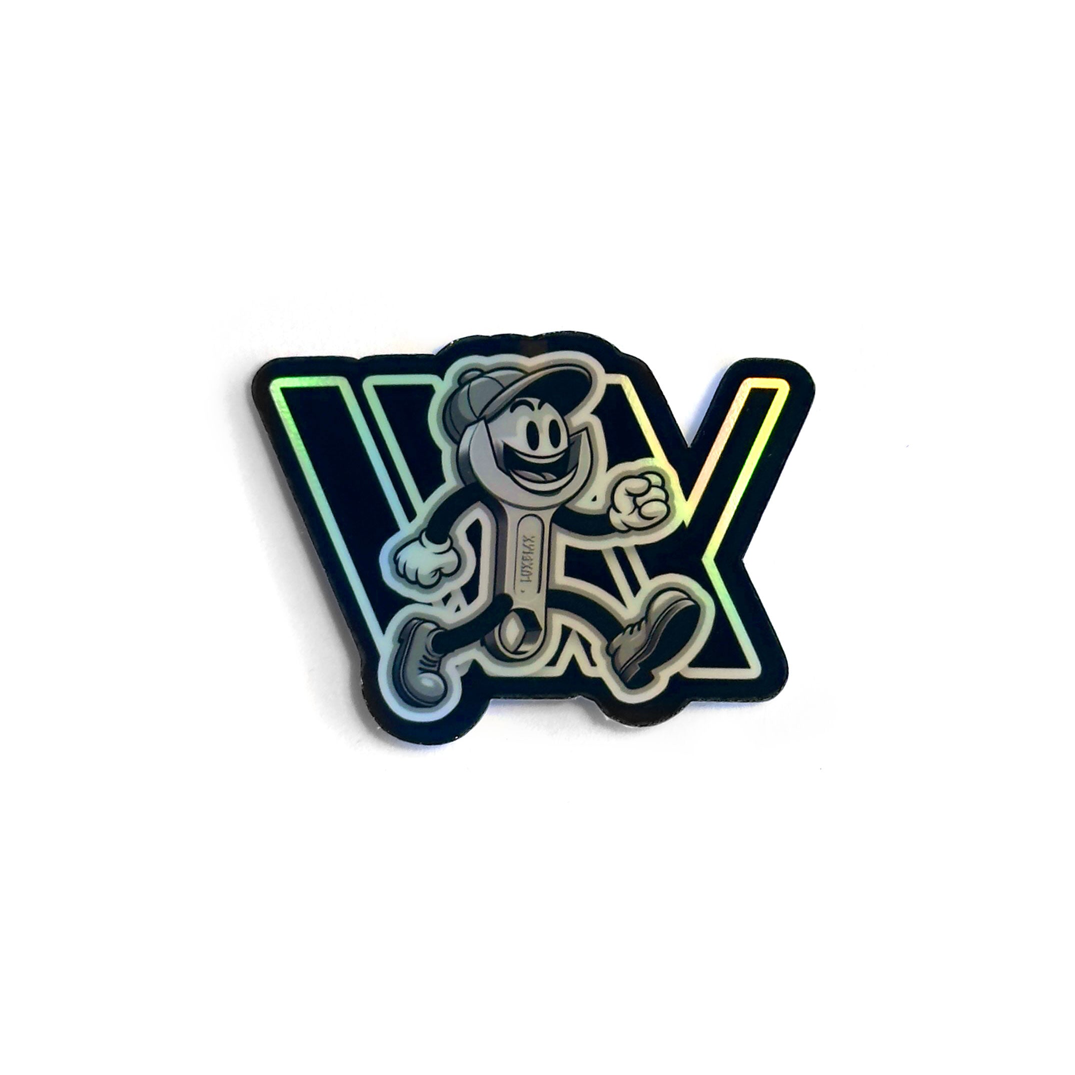 Check out the LUXBMX Spannerman Holo Sticker, showcasing a cartoon character with a hat and sneakers stepping over large "VX" letters, all crafted in holographic vinyl for that extra shine. Brought to you by LUXBMX.