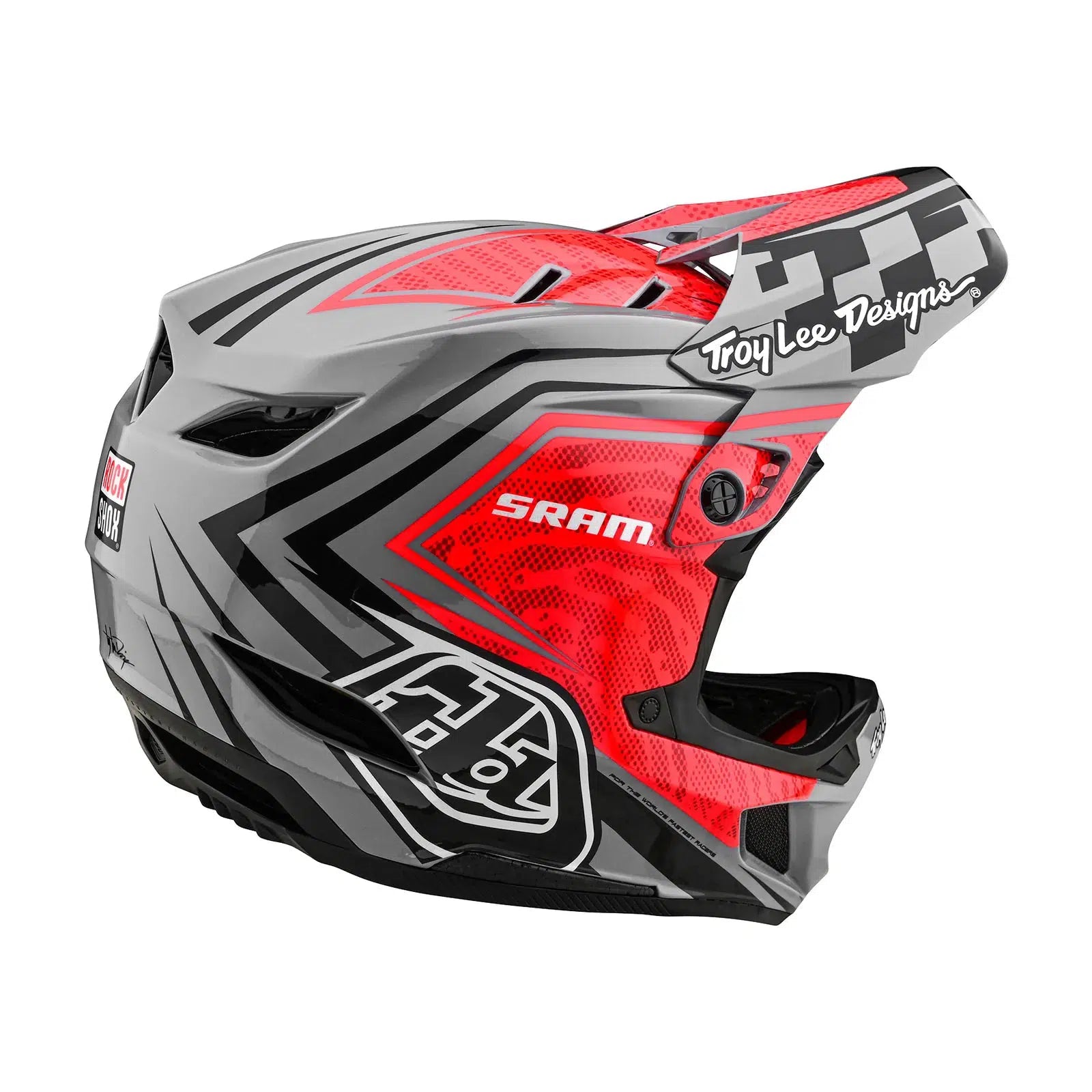 A TLD D4 Carbon AS Helmet W/MIPS SRAM Red / Black with a checkered design and MIPS Brain Protection System on it.