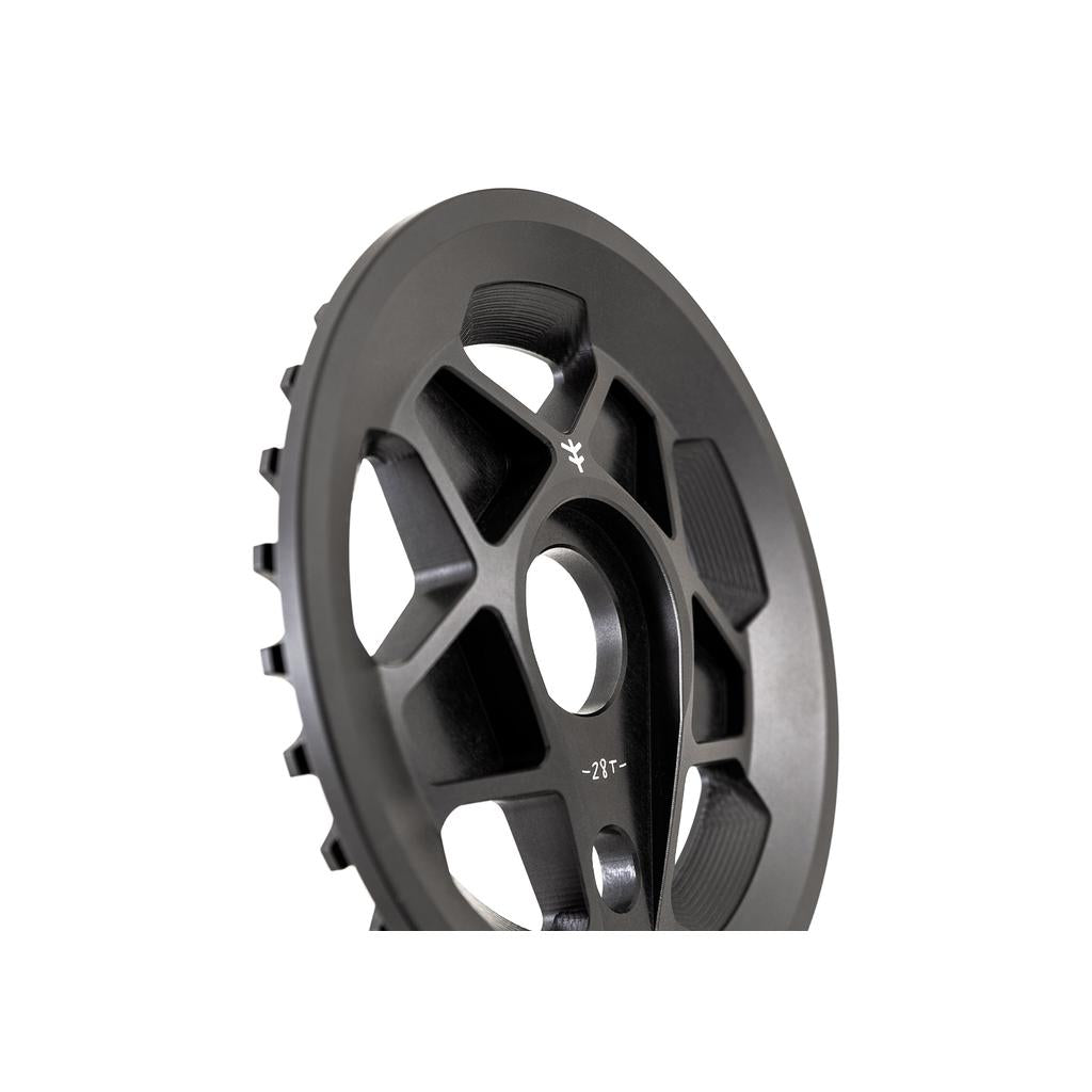 Close-up of a Fly Bikes Tractor Guard Sprocket, CNC machined from 6061 Aluminum in black, featuring a 27T engraving. It showcases a multi-spoke design and smooth finish.